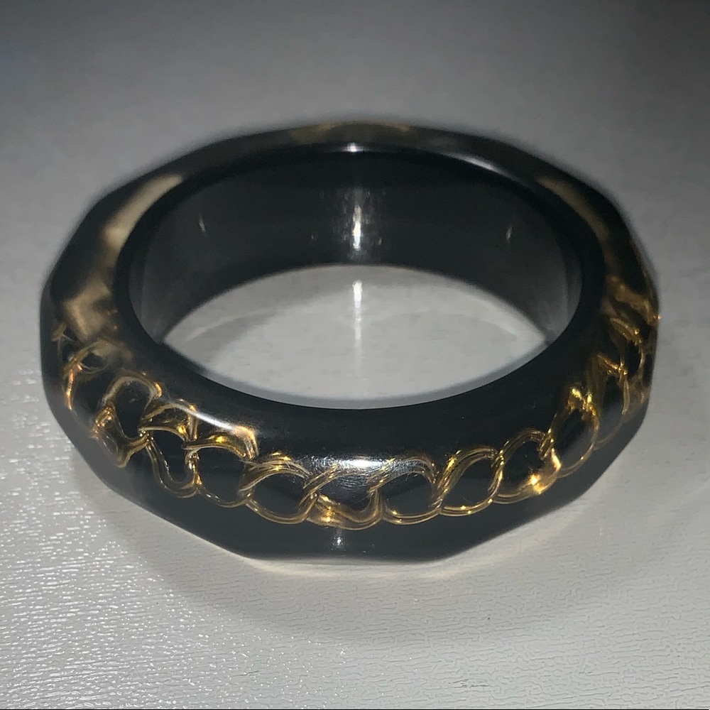 Black acrylic bangle with gold chain inside